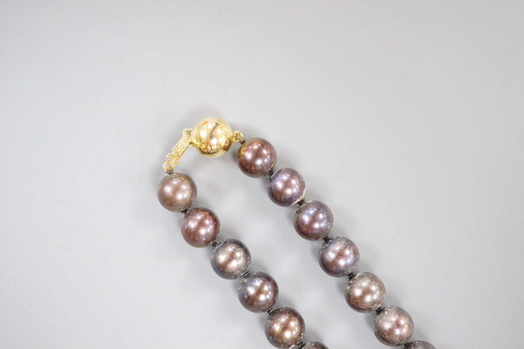 A modern single strand freshwater Tahitian style pearl necklace, with 375 yellow metal clasp, 44cm.